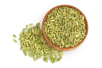 Dried fennel seeds in wooden bowl isolated on white background with clipping path. Top view. Flat...