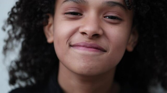 Happy hispanic little girl child portrait face close-up smile