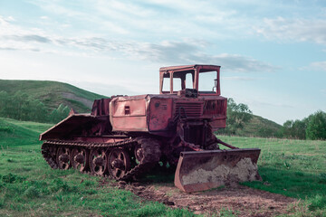Old caterpillar tractor (agricultural machinery).