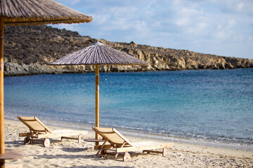 beach chairs and umbrella