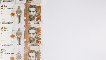 colombian money, five thousand pesos on white background