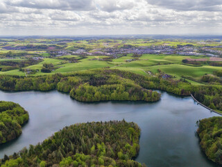 Aerial view of the Neyetalsperre (Neye Dam) in the Bergisches Land with a view of Wipperfürth in the background.