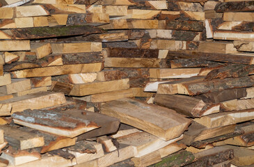 Dry chopped firewood in a bunch. Stack of firewood for kindling