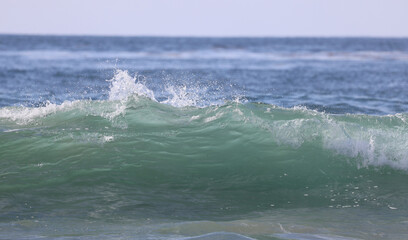 wave breaking on the beach
