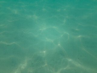 teal blue underwater ocean beach floor blured