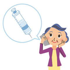 ワクチンの電話予約をするおばあさん