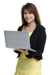 Isolated portrait closeup shot of Asian female secretary officer in black formal suit yellow dress stand smile look at camera hold silver laptop computer on hands on white background with copy space