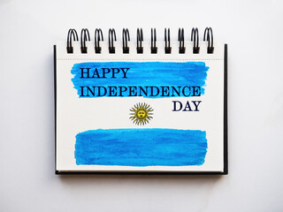 Beautiful drawing of the Argentine Flag. Greeting card. Close-up, view from above. National holiday concept. Congratulations for family, relatives, friends and colleagues