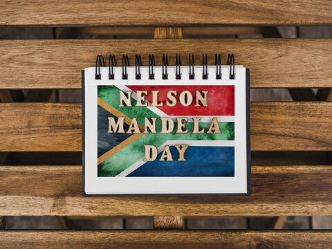 Beautiful postcard with a picture of the flag of South Africa. Closeup, view from above. National holiday concept. Congratulations for family, relatives, friends and colleagues