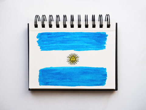 Beautiful drawing of the Argentine Flag. Greeting card. Close-up, view from above. National holiday concept. Congratulations for family, relatives, friends and colleagues