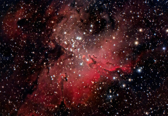 The Eagle Nebula (Messier 16 or NGC 6611) with the Pillars of Creation.  Is a young open cluster of...
