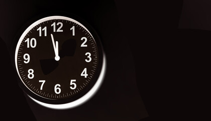 Close-up of a  modern fashioned white Wall Clock with numerals on the clock face. Clock with white frame on a black background. Pointers showing the time.  front view of the Watch out of center
