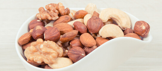 Various nuts and almonds in bowls, healthy nutrition and lifestyle concept