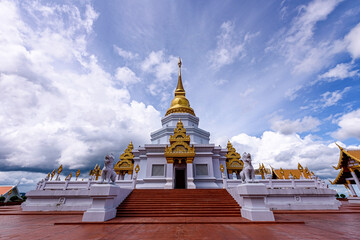 Fototapeta premium Phra Maha Chedi Thepnimittham At Phra That Santitham Temple in Village Mae Salong Nok, Chiang Rai province, Thailand.