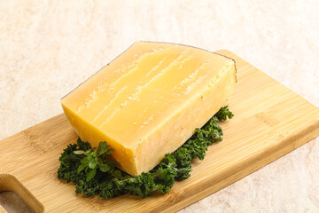 Parmesan cheese piece over board