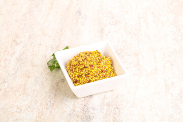 Grain mustard sauce in the bowl