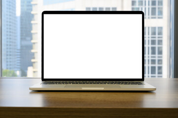 laptop with blank space on wooden table in the office and bokeh background