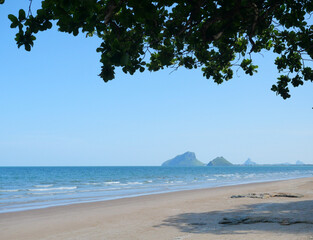 Wave splashing on the sandy beach, Blue water in the sea with island, Prachuap Khiri Khan , Thailand	