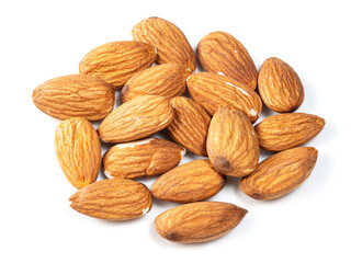 heap of almond seeds closeup on white