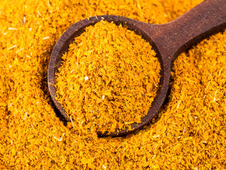 spoon on ground Dried Marigold Flowers closeup