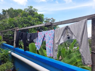 clothes that have been washed and dried in the sun, a photo that is suitable for a laundry business