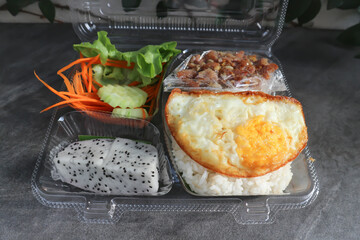 fried pork or stir fried pork and rice in the box