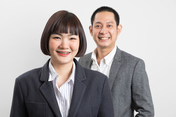 Asians executive businessman and businesswoman smile and standing on white background.