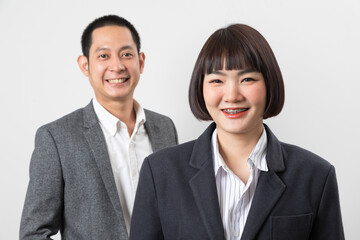 Asians executive businessman and businesswoman smile and standing on white background.