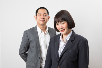 Asians executive businessman and businesswoman smile and standing on white background.