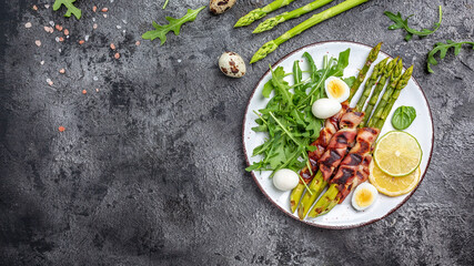Grilled green asparagus wrapped with bacon. Ketogenic diet. Healthy food, diet menu. Top view, overhead, banner.