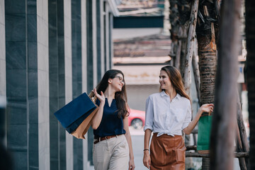 Young woman with shopping bags. Happy woman with shopping bags enjoying in shopping. lifestyle concept. Fashion woman with shopping bags walking on street.