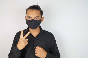 Fototapeta premium young man wearing mask , face mask , corona warriors , using sanitizer image . Vastav Kharat .
