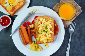 Homemade Breakfast With fried egg, bacon, toast and juice