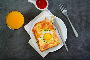 Homemade Breakfast With fried egg, bacon, toast and juice