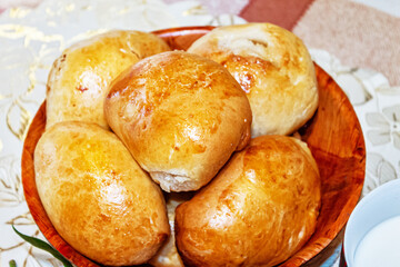 Homemade pastries. Delicious close-up pies and a glass of milk.