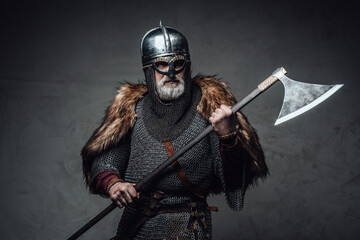 Studio shot of antique old age viking with axe