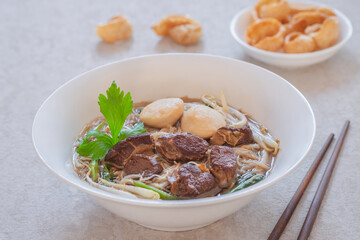 Noodle soup with braised pork and pork balls in bowl, Thai food style