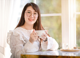 lovely Happy Portrait of asian people business female a coffee cup mug casual Relaxed in the morning in coffee shop,Business Lifestyle concept