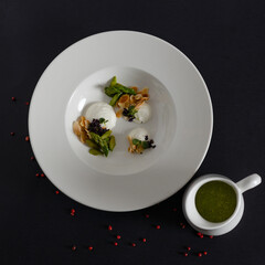 Spinach soup and white plates