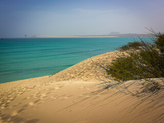 Volcanic hills in the distance, Boa Vista Island, Cape Verde. Atlantic Ocean view from a large sand...