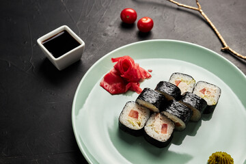 classic rolls on a plate on a black textured background top view