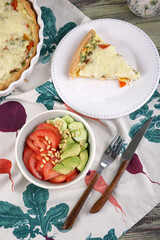 Vegetable salad with tomatoes, cucumbers, avocado and pine nuts