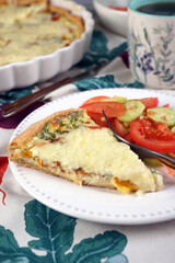 Kish. Homemade pie with scrambled eggs, vegetables and cheese.