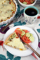 Kish. Homemade pie with scrambled eggs, vegetables and cheese.