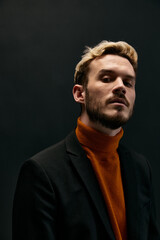 Fototapeta premium man with beard and hairstyle orange sweater jacket model 