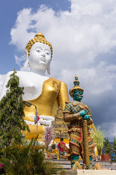 The 17-metre-tall image of sitting Buddha at Wat Phra That Doi Kham or Golden Temple, The place is one of Chiang Mai tourist attraction with impressive view