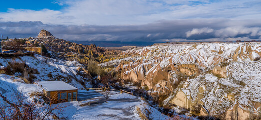 Panorama view of the famous Pigeon Valley in Cappadocia, Turkey with typical fairy chimneys and pigeon houses © Roaming Pictures