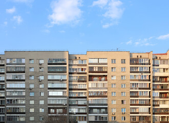 Soviet architecture. Panel house on the background of the blue sky. Residential building.