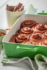 Delicious cinnamon buns with cocoa and sugar. Best Christmas snack.