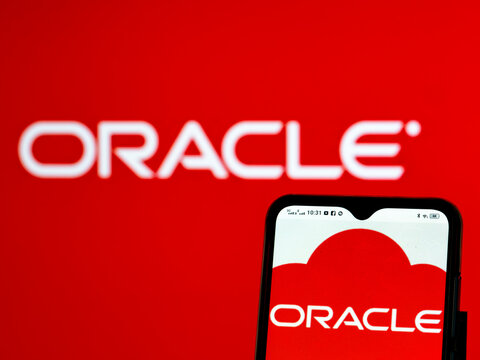 In this photo illustration Oracle Corporation logo seen displayed on a smartphone